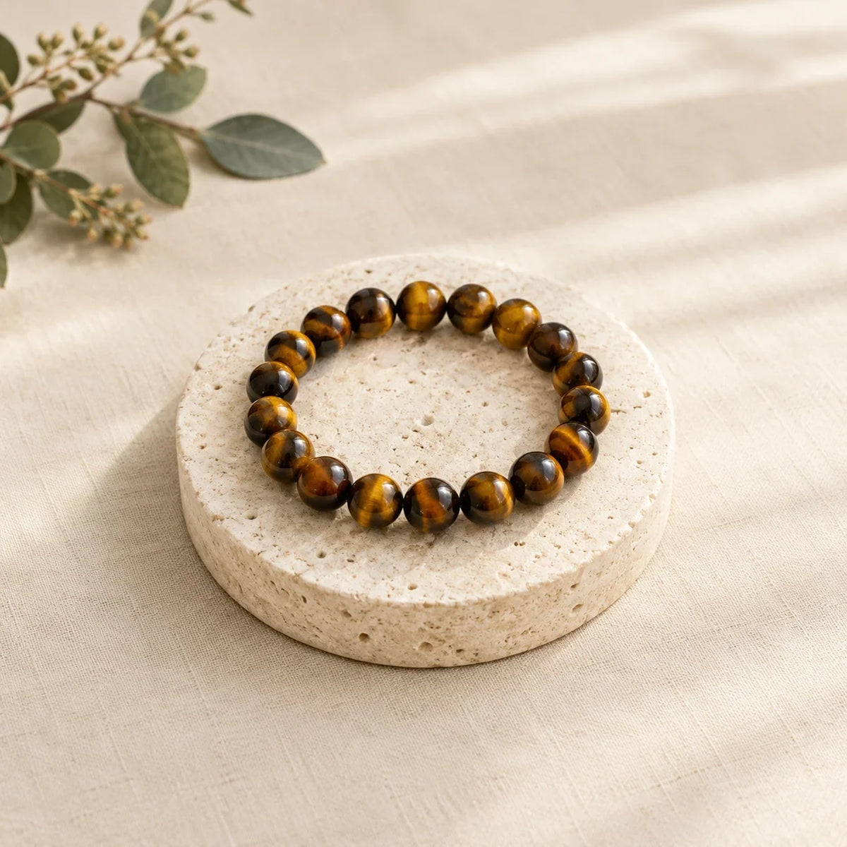 Tiger eye bead bracelet on a round travertine stone