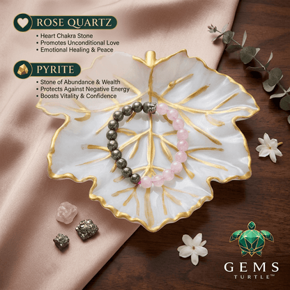 Rose Quartz Pyrite Bracelet displayed on a decorative leaf plate, symbolizing love, wealth, and success.