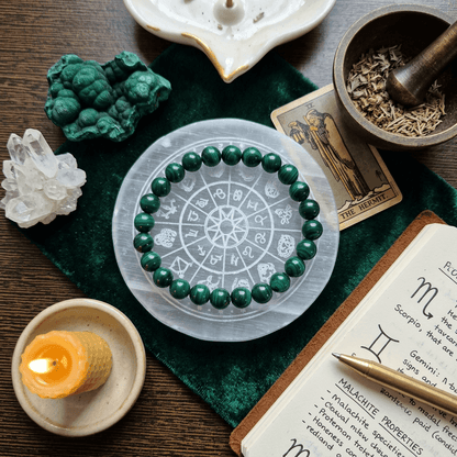 Natural Malachite Bracelet on a zodiac-themed plate with crystals and herbs, symbolizing strength and transformation.